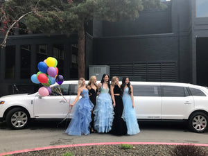 Dressed up Ladies in Front of Limo